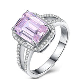 Silver ring with clear and purple cubic zirconia