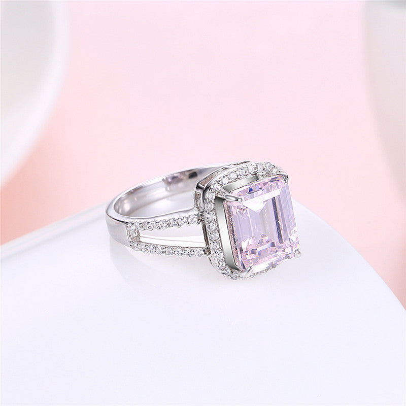 Silver ring with clear and purple cubic zirconia