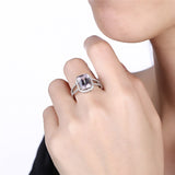 Silver ring with clear and purple cubic zirconia